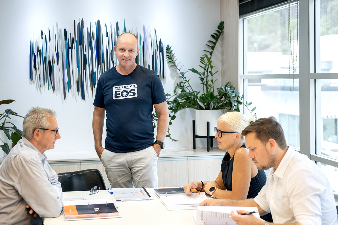 Steve Krebs, Professional EOS Implementer, at his desk with EOS materials